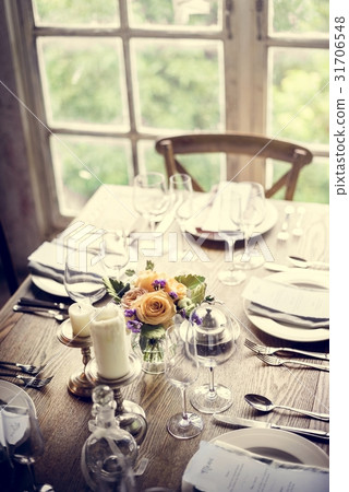 Elegant Restaurant Table Setting Service for Reception with Menu 31706548