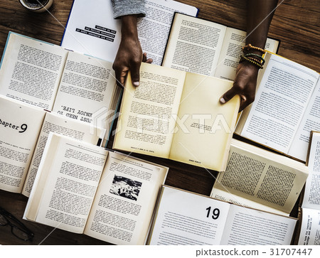 Human hand holding and reading book for research 31707447