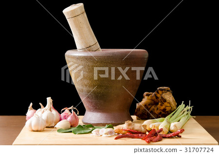 Thai food cooking by using mortar,spices and herbs Thai food cooking by using mortar,spices and herbs 31707724