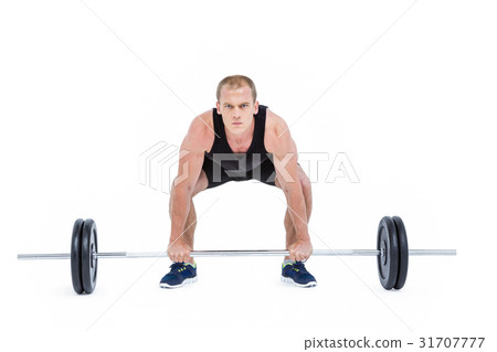 Bodybuilder lifting heavy barbell weights 31707777