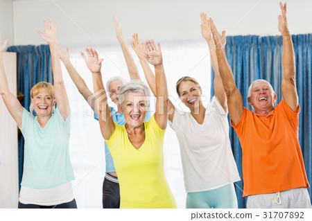 Instructor doing exercises with seniors Instructor doing exercises with seniors 31707892