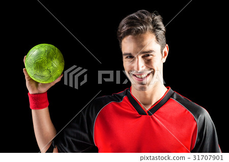 Portrait of happy athlete man holding a ball 31707901