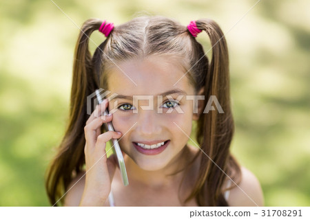 Young girl talking on mobile phone 31708291