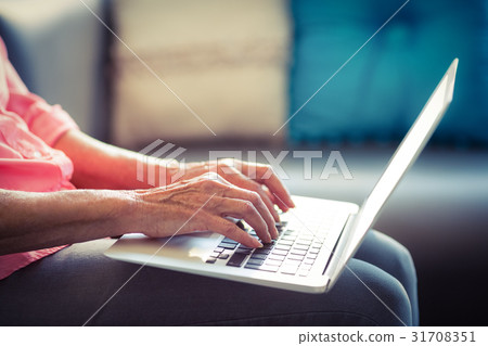 Senior woman using laptop 31708351