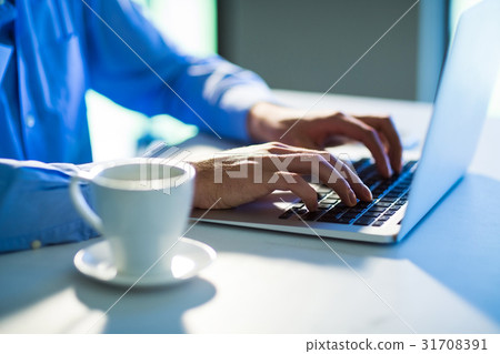 Man using laptop alone 31708391