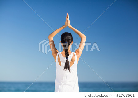 Young woman performing yoga Young woman performing yoga 31708601
