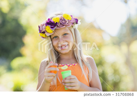 Young girl holding bubble wand Young girl holding bubble wand 31708868