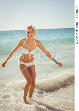 Young woman playing in water 31708982