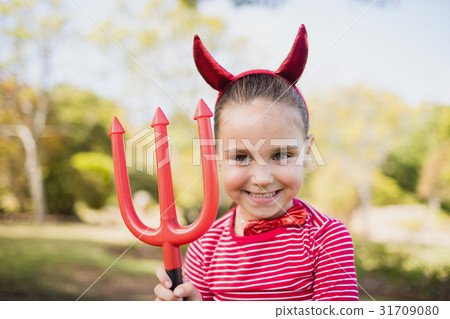Adorable girl pretending to be a devil 31709080