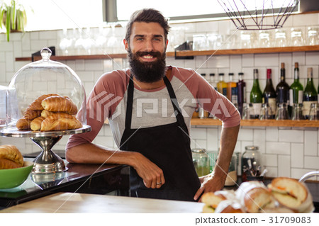 Waiter leaning against counter Waiter leaning against counter 31709083
