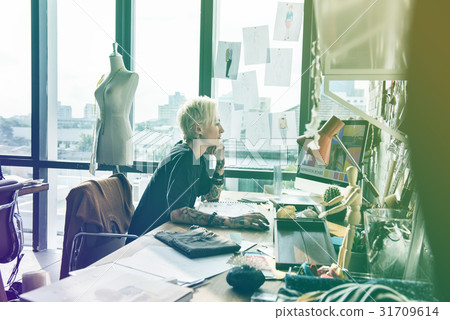 Fashion designer working on her workspace 31709614