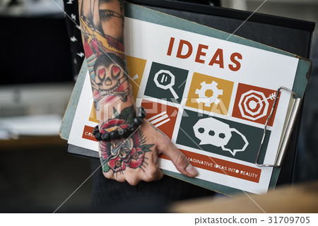 Tattooed hand with different icons on a clipboard Tattooed hand with different icons on a clipboard 31709705