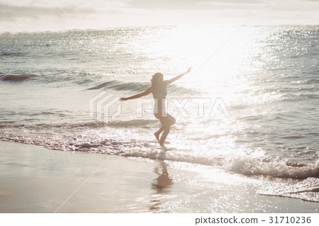 Woman playing in water Woman playing in water 31710236