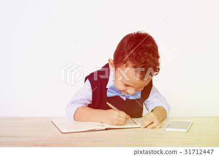Young Schoolboy Writing Bookworm Education Young Schoolboy Writing Bookworm Education 31712447