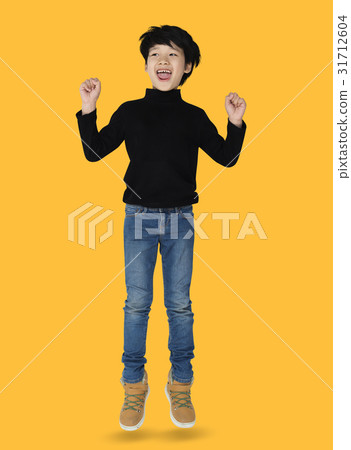 A happiness boy is jumping A happiness boy is jumping 31712604