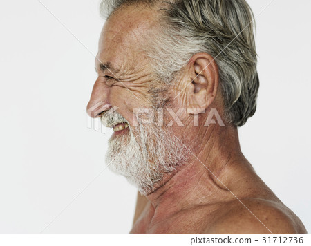 Man standing topless and posing for photoshoot Man standing topless and posing for photoshoot 31712736