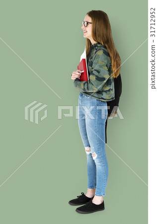 Young Adult Holding Books and School Bag Studio Portrait 31712952
