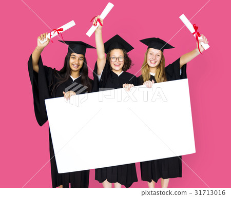 Diverse Students wearing Cap and Gown Showing Blank Copy Space Studio Portrait Diverse Students wearing Cap and Gown Showing Blank Copy Space Studio Portrait 31713016