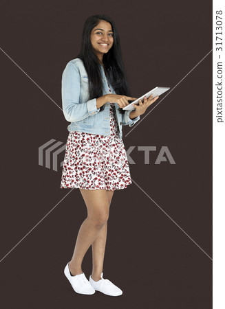 Young indian woman standing and using digital tablet 31713078