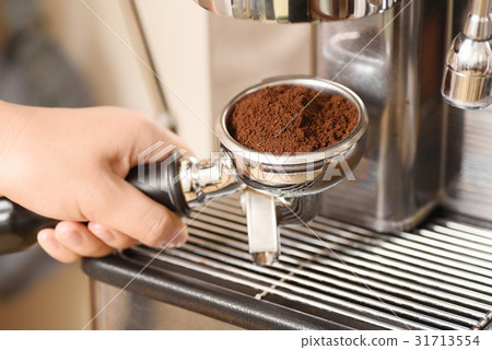 Barista making coffee from espresso machine 31713554