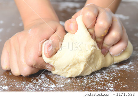 Bread cooking,kneading bread dough by hand Bread cooking,kneading bread dough by hand 31713558