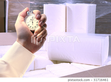 Paper napkins, towels and stopwatch in male hand Paper napkins, towels and stopwatch in male hand 31716461