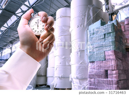 Paper products storehouse and stopwatch in hand Paper products storehouse and stopwatch in hand 31716463