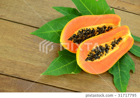 Ripe papaya on wood background. 31717795
