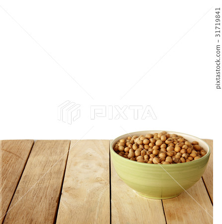 soybeens are on wooden background. soybeens are on wooden background. 31719841
