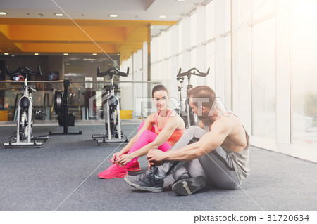 Handsome young man lace shoes at gym after 31720634