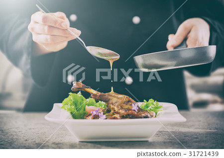 The chef prepares a gourmet meal. The chef prepares a gourmet meal. 31721439