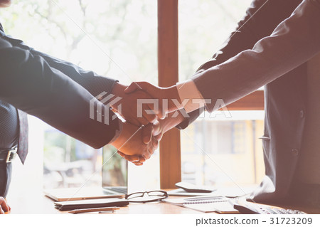 Business people shaking hands after meeting. Busi Business people shaking hands after meeting. Busi 31723209