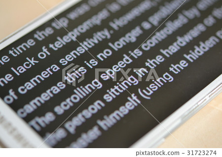 Teleprompter automatically scrolls text close-up. Teleprompter automatically scrolls text close-up. 31723274