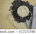 Top view of iced coffee on wooden table 31725396