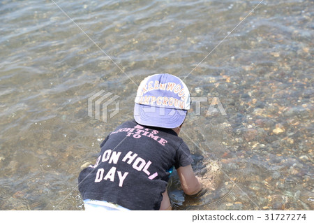 Infants playing in the sea Infants playing in the sea 31727274