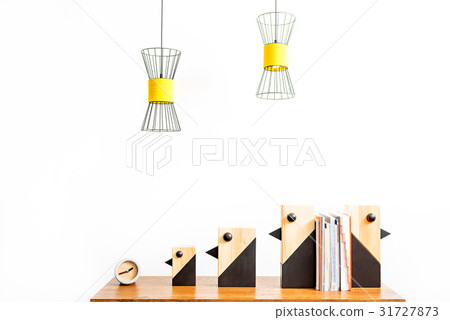 Watch and statuettes for interior with books on 31727873