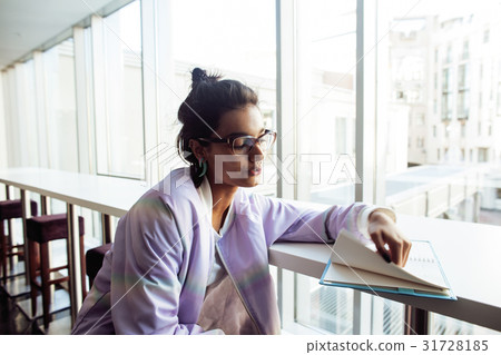 young cute hipster girl student sitting in cafe 31728185