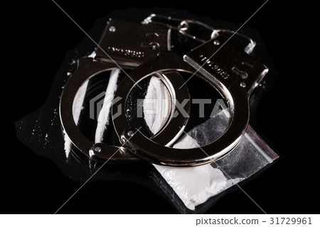 Handcuffs and cocaine Handcuffs and cocaine 31729961