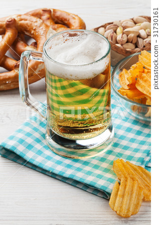 Lager beer and snacks 31730161