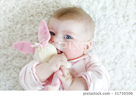 Cute baby girl playing with colorful pastel 31730506