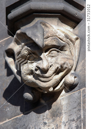 Stone head of the clown in Gothic style Stone head of the clown in Gothic style 31731012