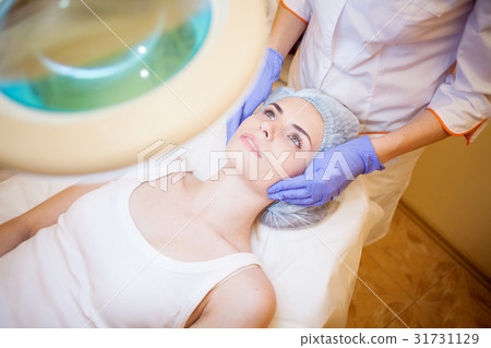 doctor cosmetologist doing facial massage girl spa doctor cosmetologist doing facial massage girl spa 31731129