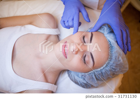 doctor cosmetologist doing facial massage girl spa doctor cosmetologist doing facial massage girl spa 31731130