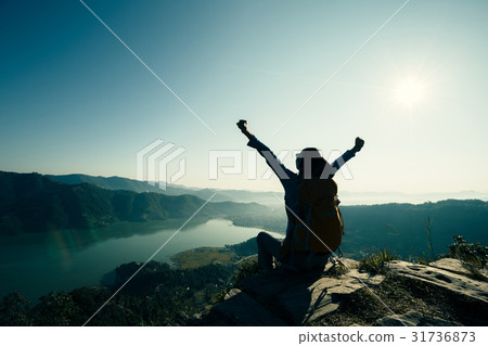 Successful woman on beautiful mountain top Successful woman on beautiful mountain top 31736873