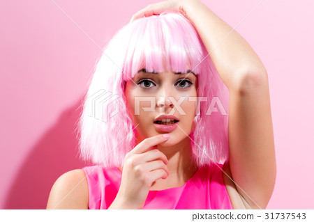Beautiful woman in a bright pink wig 31737543