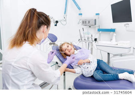 Smiling little patient at dentist Smiling little patient at dentist 31745604