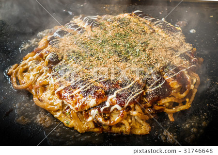 Okonomiyaki is a Japanese-style pancake Okonomiyaki is a Japanese-style pancake 31746648