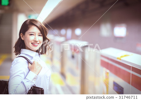 A woman waiting for the subway 31746711