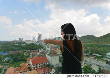 Asian girl in front of mountain in Sriracha, Chonburi, Thailand Asian girl in front of mountain in Sriracha, Chonburi, Thailand 31747519