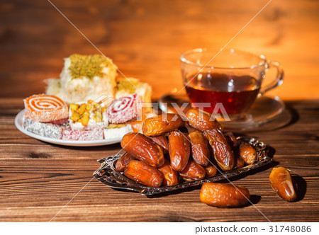dates, candy and cup of tea, muslim holy month dates, candy and cup of tea, muslim holy month 31748086